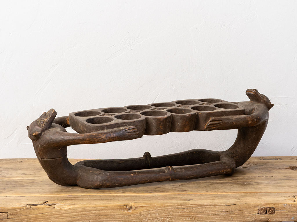 Hand-Carved Wooden Mancala Board with Monkey Finials