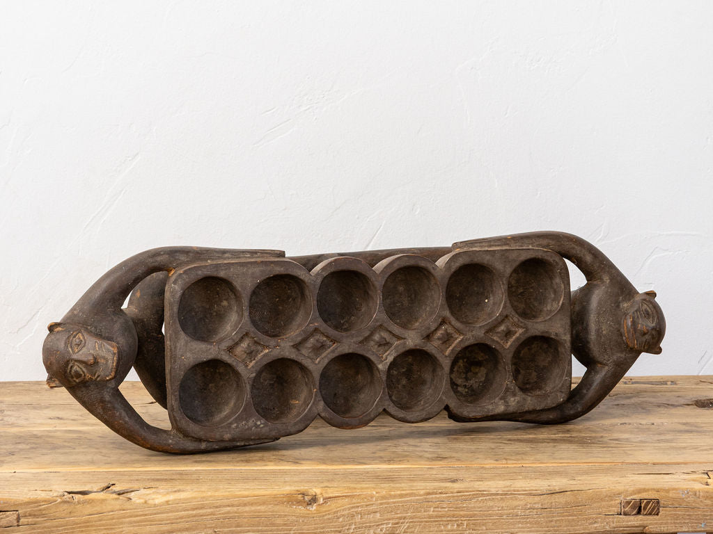 Hand-Carved Wooden Mancala Board with Monkey Finials