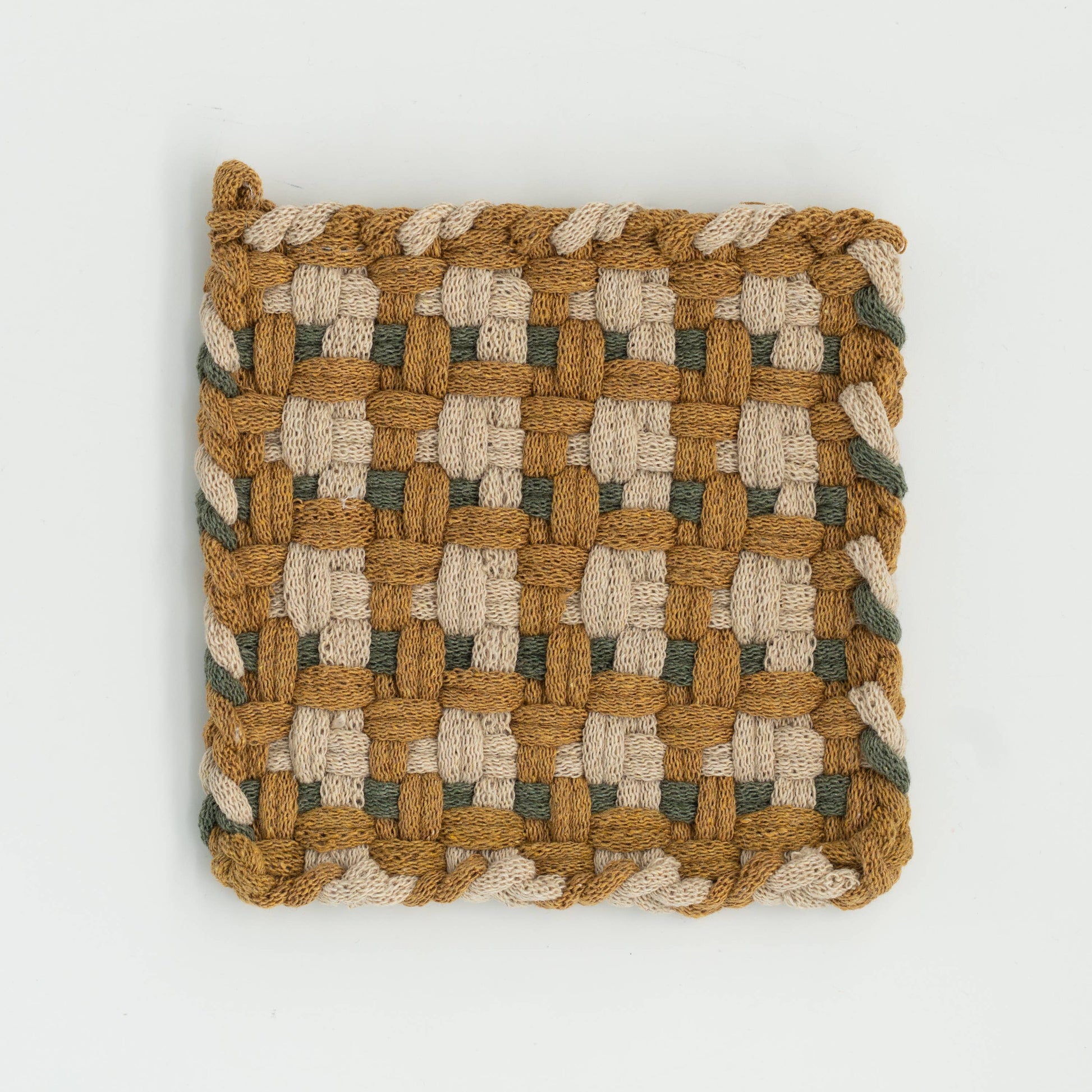 A square woven textile item, likely a small pouch, cover, or decorative square, featuring a basketweave pattern in natural tan, cream, and muted sage green on a white background.