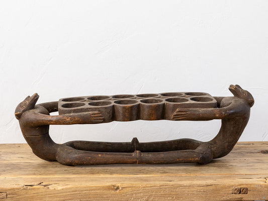Hand-Carved Wooden Mancala Board with Monkey Finials