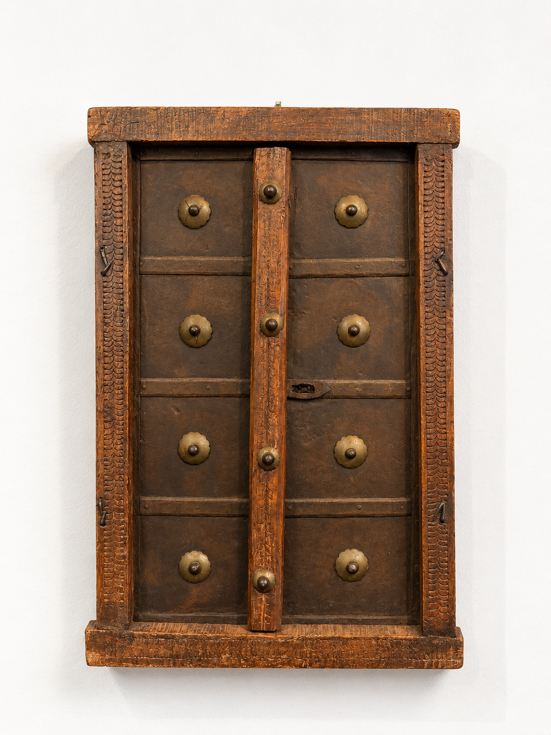 Wooden cabinet with brass knobs on a white background